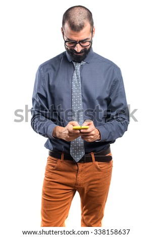 Similar – young latin man typing on his phone with emoji emoticons.