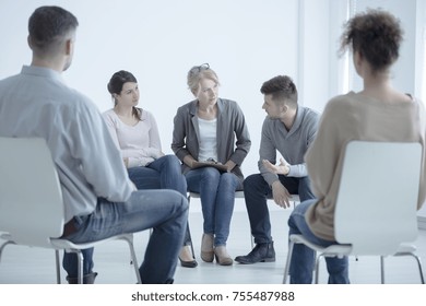 Man Talking To A Psychotherapist About Family Problems During Meeting With Support Group