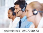 Man, talking and smile in call center for customer service, telemarketing and FAQ in office. Male agent, contact and headset at help desk with team, communication or bilingual consultant with tech