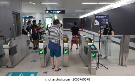 A Man Tap In Card On Jakarta MRT Entrance Gate. Jakarta, 11 October 2021.