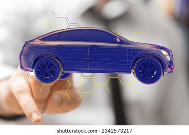 A man tapping a floating 3D rendering of a holographic smart car
