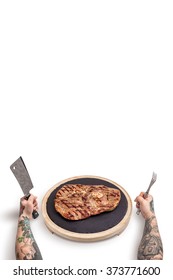 A Man Tattooed With Knife And Fork Eating A Big Juicy Steak