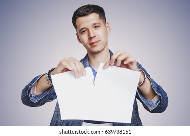A man is tearing paper