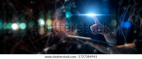 Man technology future lifestyle, digital\
marketing IOT internet of thing future AI technology smart city\
device social network, man with tablet surfing internet with\
futuristic metaverse\
background