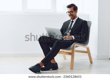 Man technology occupation winner job looking chair office laptop sitting business businessman happy