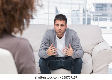Man Telling Therapist His Problems Sitting On The Couch