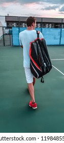 Man With A Tennis Bag On The Court