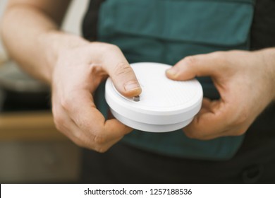 Man Testing Smoke Detector Before Use.