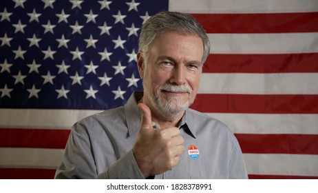 man that just voted takes off mask and gives thumbs up