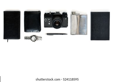 Man things flat lay border. Composition with camera, watch, flask and purse on white background.