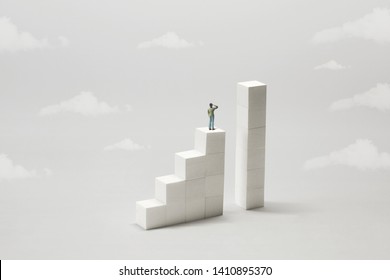 man thinking how to fill the gap to reach the next level - Shutterstock ID 1410895370
