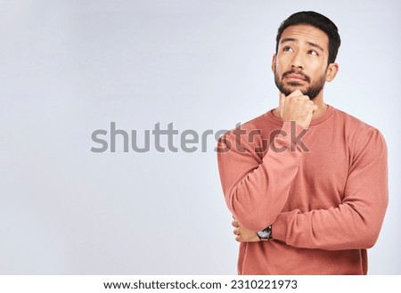 Man, thinking and idea mockup in studio or planning, decision and choice with white background. Asian male, model and curious face with doubt, questions or confused guy try to remember with space