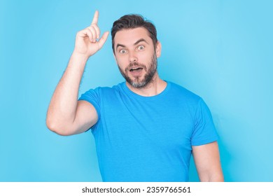 Man thinking of idea on studio background. Portrait of man has many ideas. Man with index fingers hand gesture man has idea, presenting promo offer. Decision idea process. Good idea.