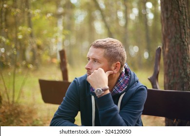 Man Thinking Moody Portrait, Sitting At Autumn Park, Selective Focus