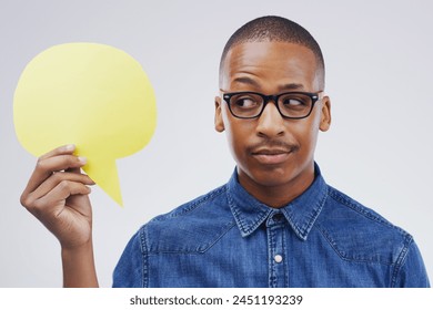 Man, thinking and studio with speech bubble or comment, idea and promotion for advertising. Opinion, faq and quote for product placement, reply or answer for conversation on white background