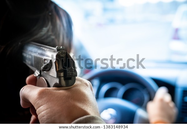 man threatens with a gun in
the car. the criminal took a man hostage. criminal district of the
city