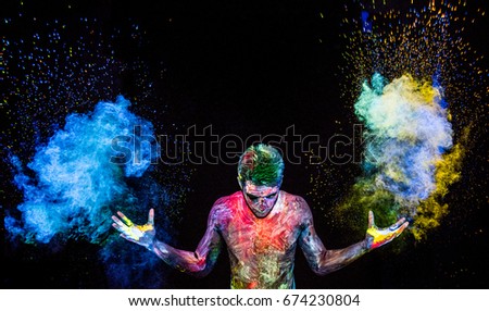 Man throwing up glowing powder