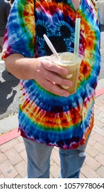 Man In Tie Dye Shirt Holding An Italian Ice