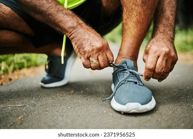 Man, tie and shoes in fitness for running, workout or outdoor exercise on road, street or asphalt. Closeup of male person, hands and tying shoe getting ready or preparation for sports, cardio or run - Powered by Shutterstock