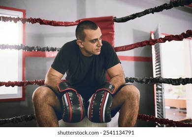 Man, tired boxer and fitness in ring at gym, sports fail and mma athlete for training defeat. Male person, exhausted sportsman and rest in corner for loss, stress and workout fatigue in practice - Powered by Shutterstock