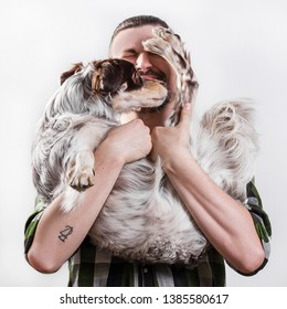 Man Took The Dog From Shelter, They Indulge. Animal Under The Protection And Care Of Person, On White Background. Unconditional Love, Friendship And Loyalty