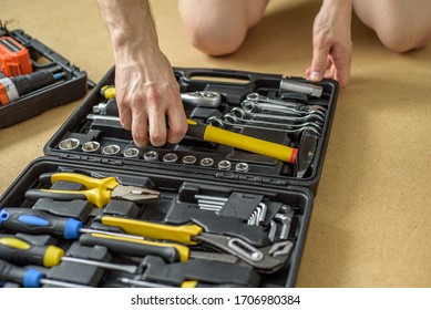 A Man Took Tool From A Case For Work. Close Up