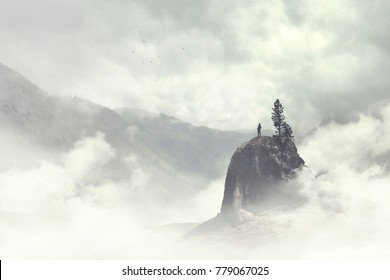 man of the top of the mountain in the fog