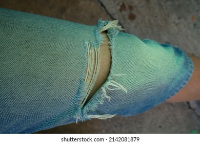 Man In Torn Jeans Blue Texture Fashion