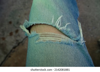 Man In Torn Jeans Blue Texture Fashion