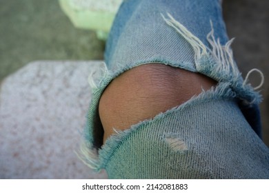 Man In Torn Jeans Blue Texture Fashion