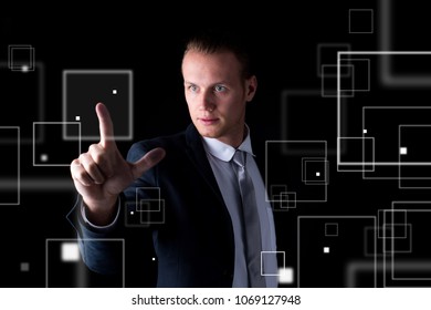 Man touch in graphic screen on black background. Business and technology concept.