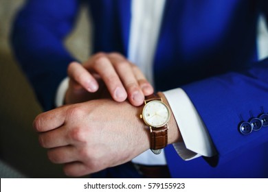 Man Touches Watch With Leather Bracelet On His Wirst