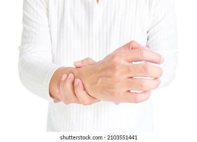 The man touches the wrist and thumb. He squeezes the knuckle of the thumb and wrist. He suffered a tendon injury, arthritis in his wrist, and de Quervain's disease.