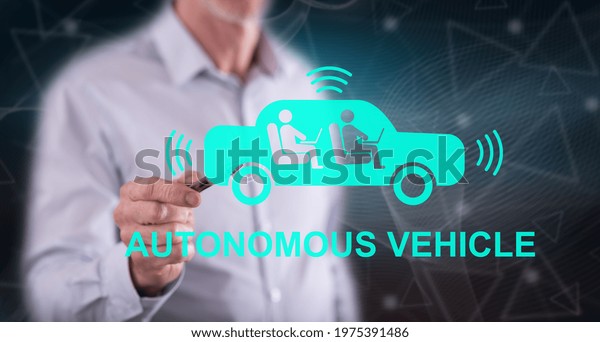 Man touching an autonomous vehicle concept on a touch\
screen with a pen