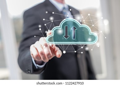 Man touching a cloud networking concept on a touch screen with his fingers