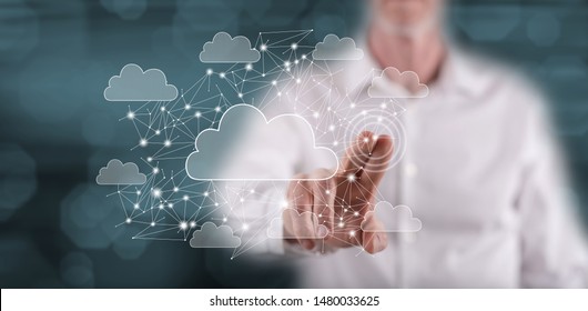 Man touching a cloud networking concept on a touch screen with his finger