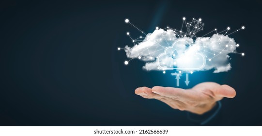 Man touching connect to data information on the Cloud Computing Technology Internet Storage Network Concept And a large database big data Through internet technology, Cloud sharing download and upload - Shutterstock ID 2162566639