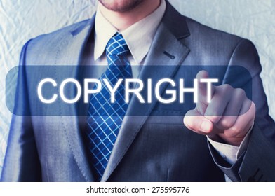 Man touching Copyright button on virtual screen