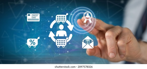 Man touching a customer loyalty concept on a touch screen with his finger - Shutterstock ID 2097578326