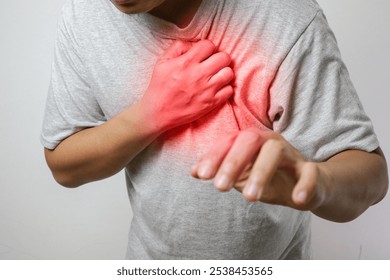 a man touching his heart, with red highlight of heart attack, and others heart disease concept, on white background - Powered by Shutterstock