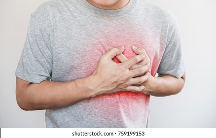 A Man Touching His Heart, With Red Highlight Of Heart Attack, Heart Failure And Others Heart Disease