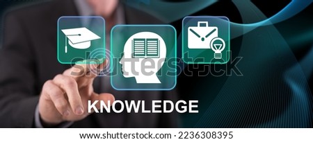 Man touching a knowledge concept on a touch screen with his finger