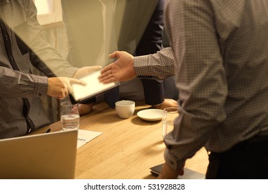 Man Touching Screen Electronic Tablet Hand.Project Managers Researching Process.Business Team Working New Start up modern Office.International Digital Diagrams Interfaces.Analyze market 