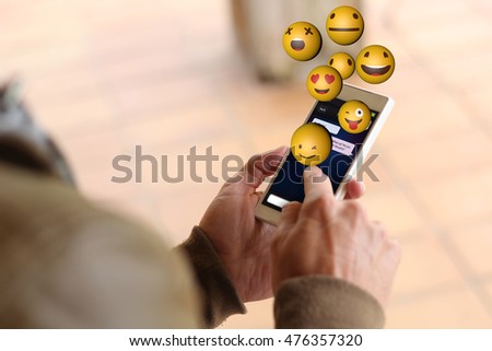 Similar – Nahaufnahme der Frau mit dem Smartphone, die Emojis sendet.