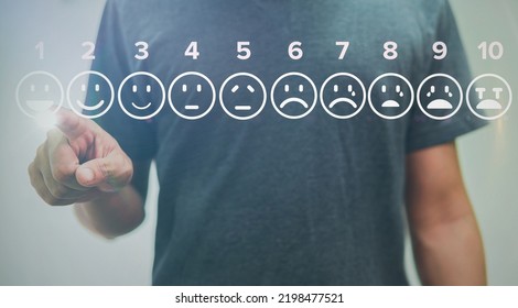 man touching smile icons of pain scale virtual screen interface, medical technology and futuristic concept. - Powered by Shutterstock - Get 15% off with code: PIKWIZARD15