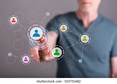 Man touching a social media network on a touch screen with his finger