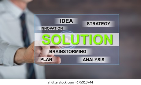 Man touching a solution concept on a touch screen with his finger