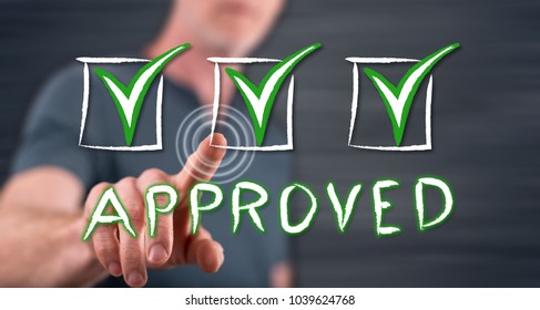 Man touching a validation concept on a touch screen with his finger