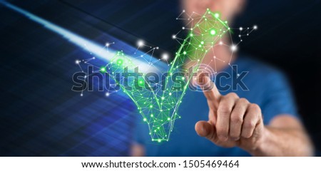 Man touching a validation concept on a touch screen with his finger