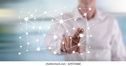 Man touching a virtual network concept on a touch screen with his finger